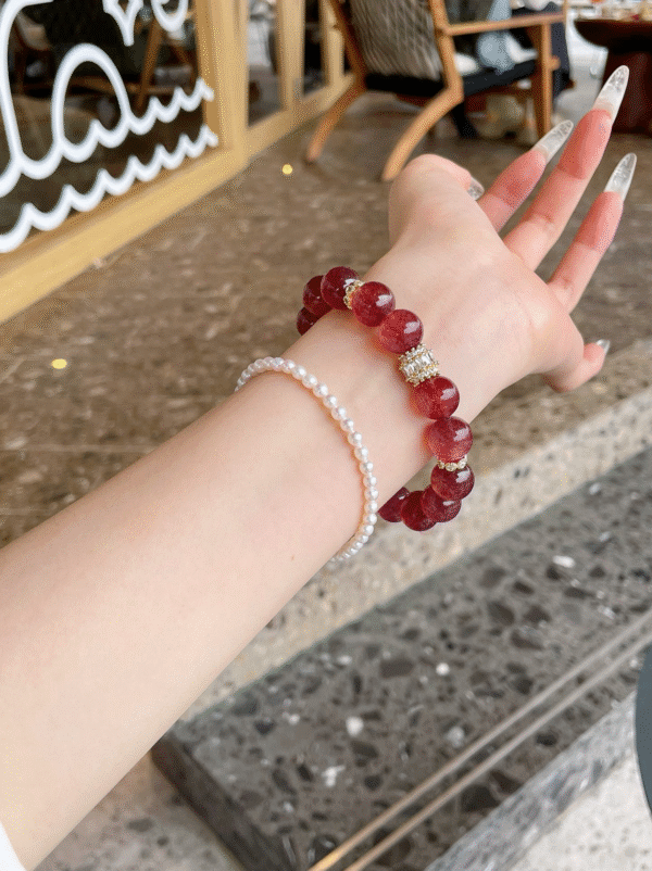 Starlight Strawberry Quartz Crystal Bracelet on wrist