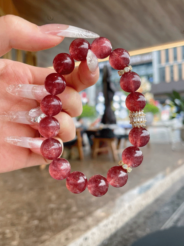 Starlight Strawberry Quartz Crystal Bracelet on wrist